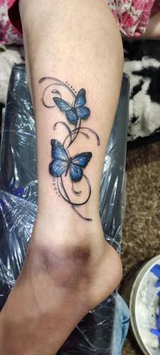 butterfly tatoo leg